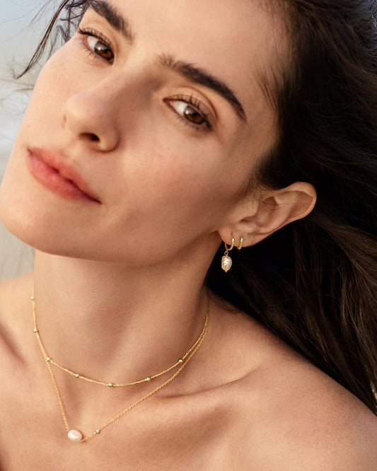 Gold Pearl Mini Hoop Earrings wron on ear
