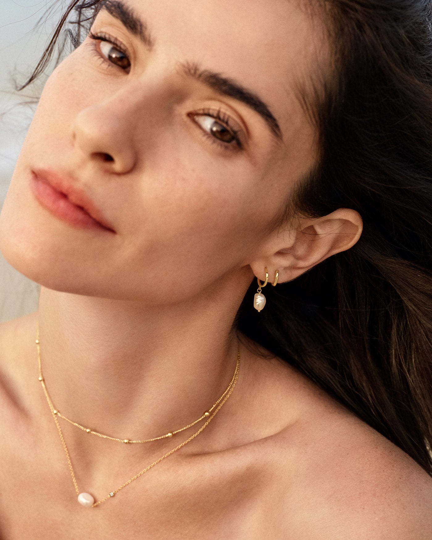 Gold Pearl Mini Hoop Earrings wron on ear