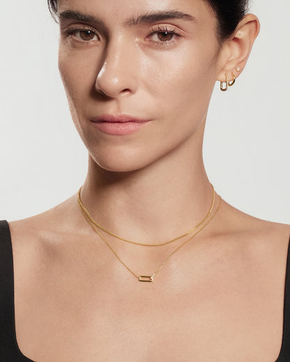 Gold Glam Interlock Necklace with a gold chain