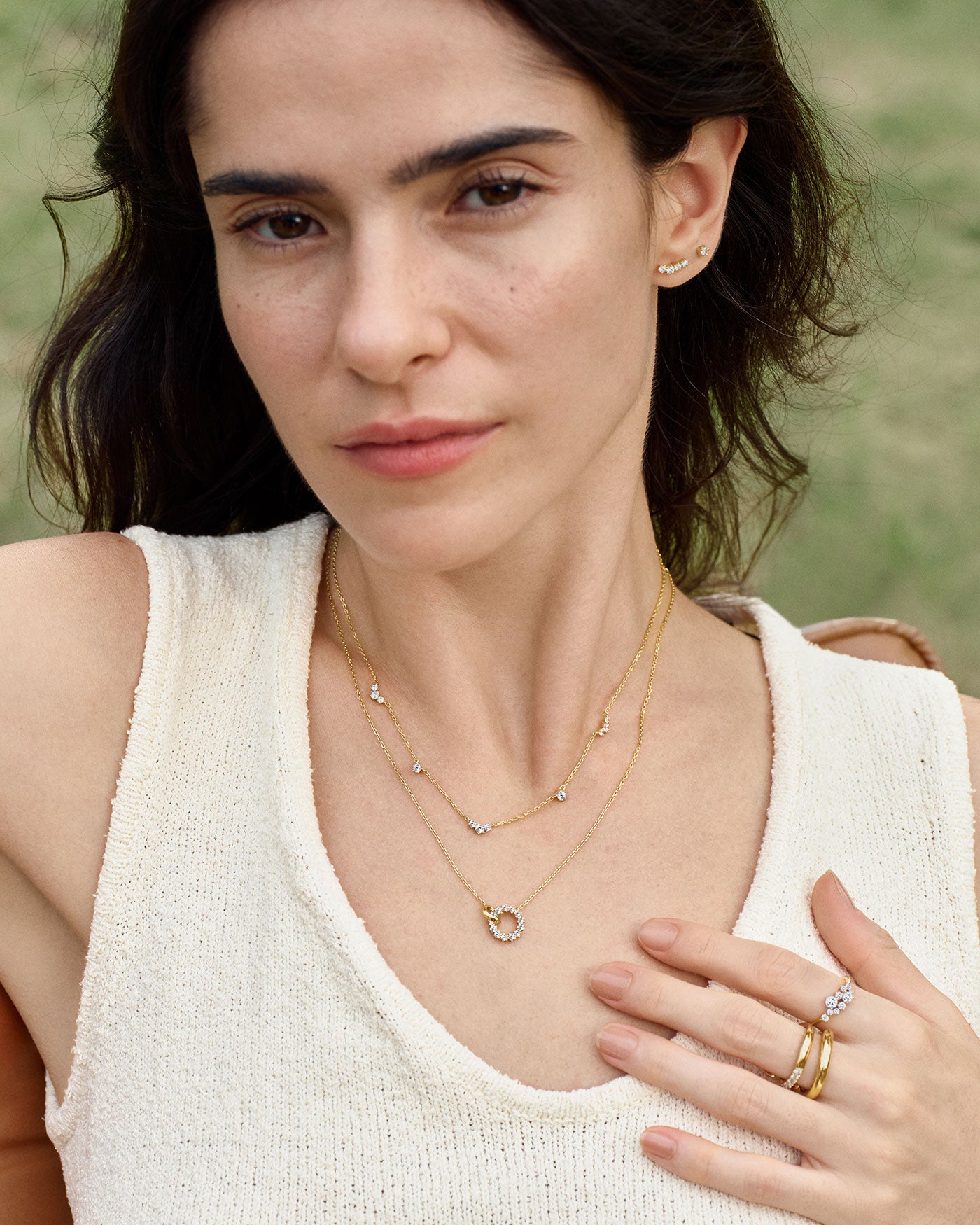 Gold interlinked circles necklace layered with delicate necklace